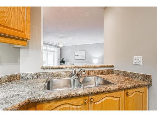 302-443 Centennial Forest Drive, Milton, ON - Indoor Photo Showing Kitchen With Double Sink