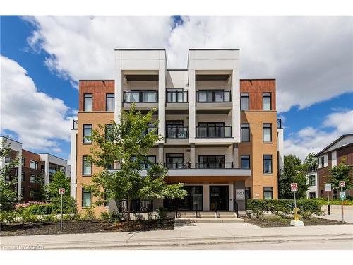 210-120 Canon Jackson Drive, Toronto, ON - Outdoor With Balcony With Facade