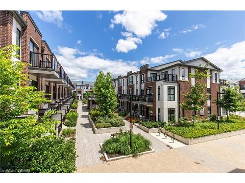 210-120 Canon Jackson Drive, Toronto, ON - Outdoor With Balcony With Facade