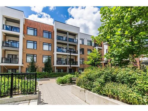 210-120 Canon Jackson Drive, Toronto, ON - Outdoor With Balcony With Facade