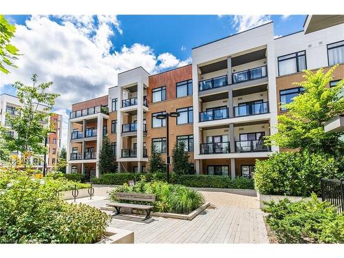 210-120 Canon Jackson Drive, Toronto, ON - Outdoor With Balcony With Facade