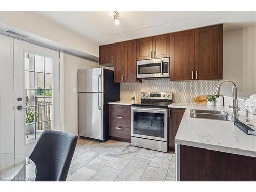 305-4005 Kilmer Drive, Burlington, ON - Indoor Photo Showing Kitchen With Double Sink