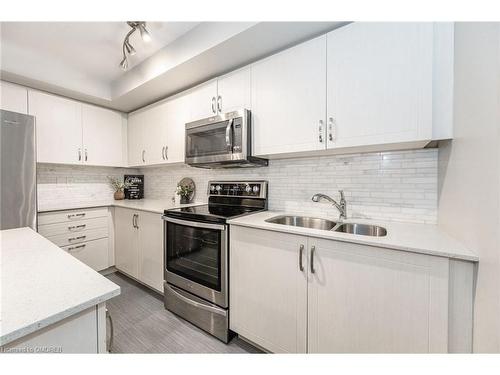 4-01-2420 Baronwood Drive, Oakville, ON - Indoor Photo Showing Kitchen With Stainless Steel Kitchen With Double Sink