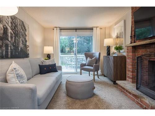 586 Hayward Crescent, Milton, ON - Indoor Photo Showing Living Room With Fireplace