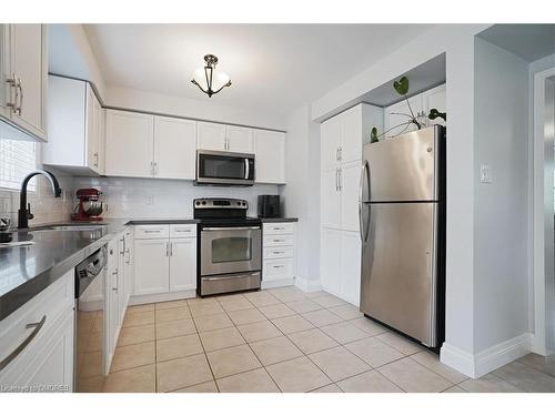 2-2360 Parkhaven Boulevard, Oakville, ON - Indoor Photo Showing Kitchen With Stainless Steel Kitchen With Double Sink