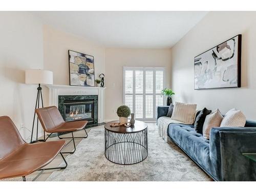 34-20 Kitty Murray Lane, Ancaster, ON - Indoor Photo Showing Living Room With Fireplace