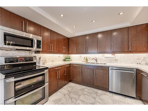 1905-2170 Marine Drive, Oakville, ON - Indoor Photo Showing Kitchen With Double Sink