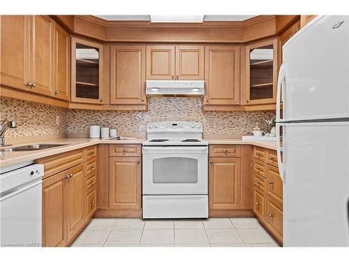 1106-2185 Marine Drive, Oakville, ON - Indoor Photo Showing Kitchen With Double Sink