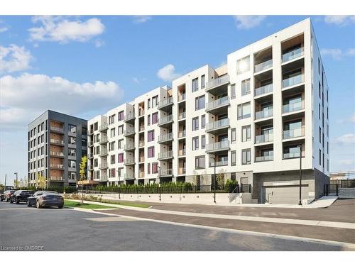 202-1440 Clarriage Court, Milton, ON - Outdoor With Balcony With Facade