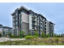 423-102 Grovewood Common, Oakville, ON  - Outdoor With Balcony With Facade 