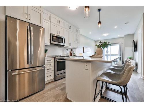 423-102 Grovewood Common, Oakville, ON - Indoor Photo Showing Kitchen With Stainless Steel Kitchen With Upgraded Kitchen