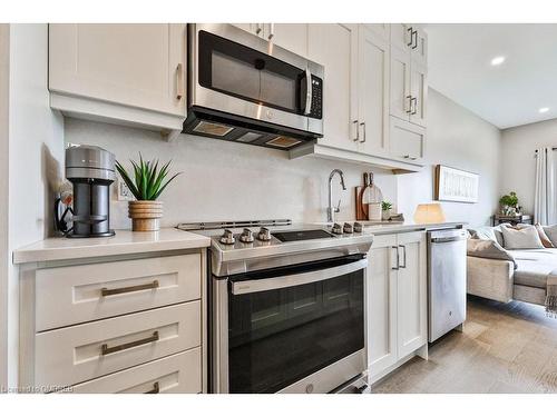 423-102 Grovewood Common, Oakville, ON - Indoor Photo Showing Kitchen With Stainless Steel Kitchen With Upgraded Kitchen