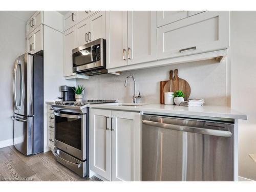 423-102 Grovewood Common, Oakville, ON - Indoor Photo Showing Kitchen With Stainless Steel Kitchen With Upgraded Kitchen