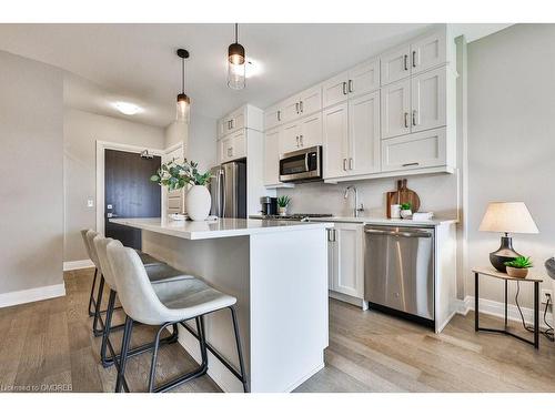 423-102 Grovewood Common, Oakville, ON - Indoor Photo Showing Kitchen With Stainless Steel Kitchen With Upgraded Kitchen