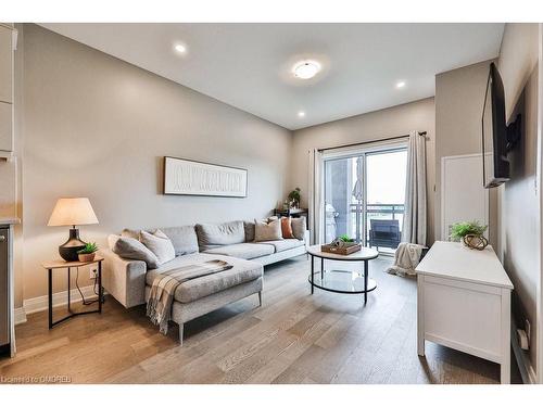 423-102 Grovewood Common, Oakville, ON - Indoor Photo Showing Living Room With Fireplace