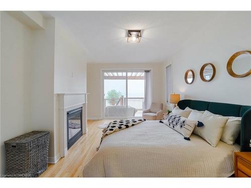 25 Waterview Road, Wasaga Beach, ON - Indoor Photo Showing Bedroom With Fireplace