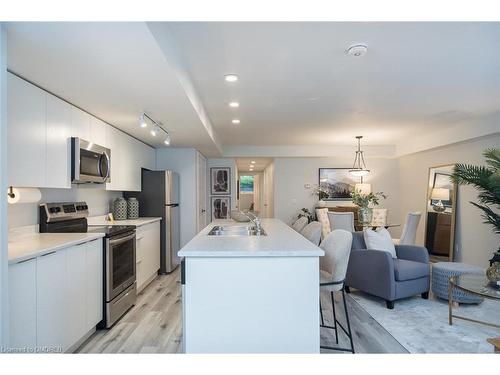 106-3058 Sixth Line, Oakville, ON - Indoor Photo Showing Kitchen With Stainless Steel Kitchen With Double Sink