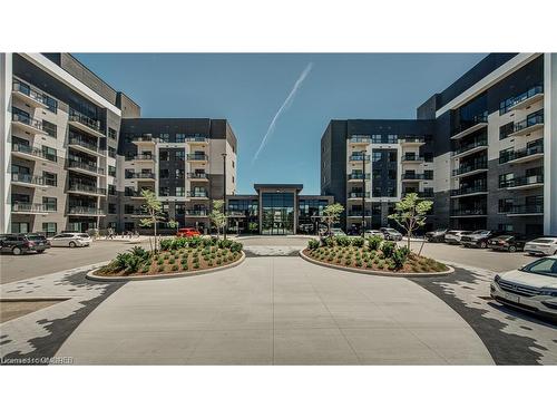 417-102 Grovewood Common, Oakville, ON - Outdoor With Balcony With Facade