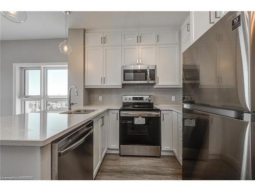 417-102 Grovewood Common, Oakville, ON - Indoor Photo Showing Kitchen With Stainless Steel Kitchen With Double Sink