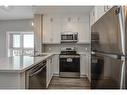 417-102 Grovewood Common, Oakville, ON  - Indoor Photo Showing Kitchen With Stainless Steel Kitchen With Double Sink 