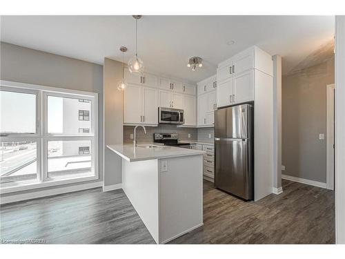 417-102 Grovewood Common, Oakville, ON - Indoor Photo Showing Kitchen With Stainless Steel Kitchen