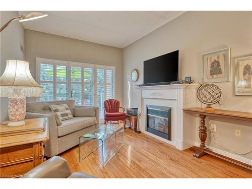 316-2085 Amherst Heights Drive, Burlington, ON - Indoor Photo Showing Living Room With Fireplace