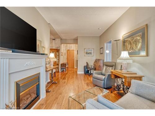 316-2085 Amherst Heights Drive, Burlington, ON - Indoor Photo Showing Living Room With Fireplace