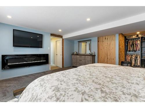 4999 Canborough Road, Wellandport, ON - Indoor Photo Showing Bedroom With Fireplace