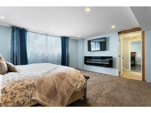 4999 Canborough Road, Wellandport, ON - Indoor Photo Showing Bedroom With Fireplace