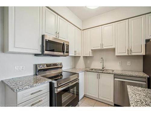 719-2490 Old Bronte Road, Oakville, ON - Indoor Photo Showing Kitchen With Stainless Steel Kitchen With Double Sink With Upgraded Kitchen