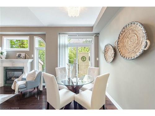 3382 Whilabout Terrace, Oakville, ON - Indoor Photo Showing Dining Room With Fireplace