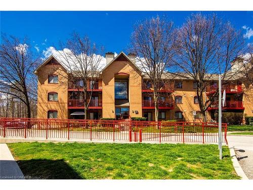 124-1496 Pilgrims Way, Oakville, ON - Outdoor With Facade