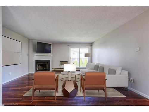 124-1496 Pilgrims Way, Oakville, ON - Indoor Photo Showing Living Room With Fireplace