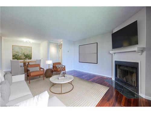 124-1496 Pilgrims Way, Oakville, ON - Indoor Photo Showing Living Room With Fireplace