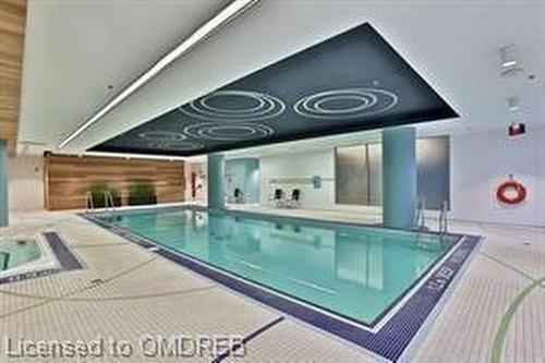 209-65 Speers Road, Oakville, ON - Indoor Photo Showing Other Room With In Ground Pool