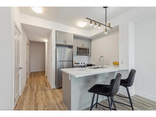 1001-450 Dundas Street E, Waterdown, ON - Indoor Photo Showing Kitchen With Stainless Steel Kitchen With Double Sink