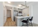 1001-450 Dundas Street E, Waterdown, ON  - Indoor Photo Showing Kitchen With Stainless Steel Kitchen With Double Sink 