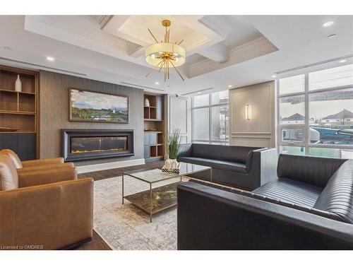 1001-450 Dundas Street E, Waterdown, ON - Indoor Photo Showing Living Room With Fireplace