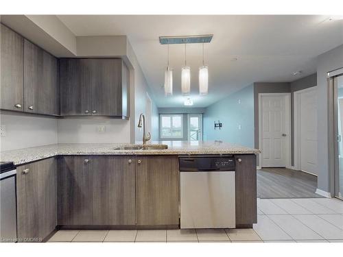 305-1005 Nadalin Heights, Halton, ON - Indoor Photo Showing Kitchen With Double Sink