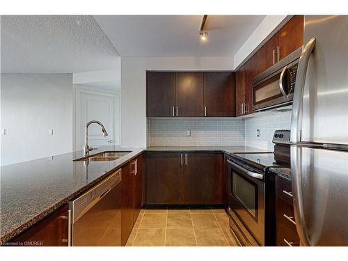 709-1940 Ironstone Drive, Burlington, ON - Indoor Photo Showing Kitchen With Stainless Steel Kitchen With Double Sink With Upgraded Kitchen