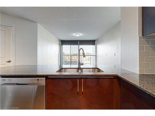 709-1940 Ironstone Drive, Burlington, ON - Indoor Photo Showing Kitchen With Double Sink