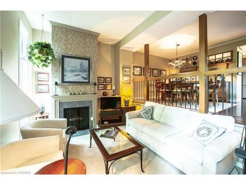 48-1250 Marlborough Court, Oakville, ON - Indoor Photo Showing Living Room With Fireplace