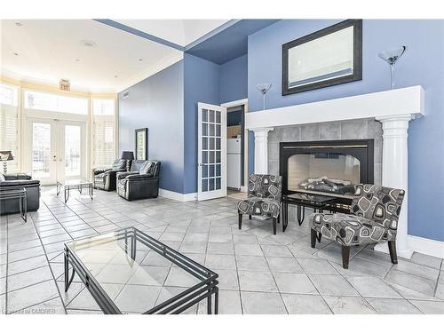 314-1451 Walker'S Line, Burlington, ON - Indoor With Fireplace