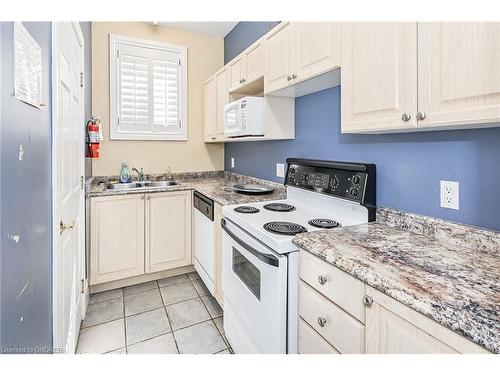 314-1451 Walker'S Line, Burlington, ON - Indoor Photo Showing Kitchen With Double Sink