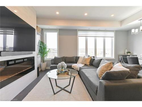 7-145 Long Branch Avenue, Etobicoke, ON - Indoor Photo Showing Living Room With Fireplace