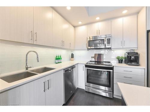 7-145 Long Branch Avenue, Etobicoke, ON - Indoor Photo Showing Kitchen With Stainless Steel Kitchen With Double Sink With Upgraded Kitchen