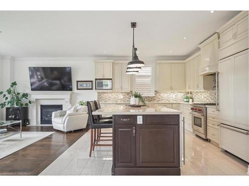 2447 Chateau Common, Oakville, ON - Indoor Photo Showing Kitchen With Fireplace With Upgraded Kitchen