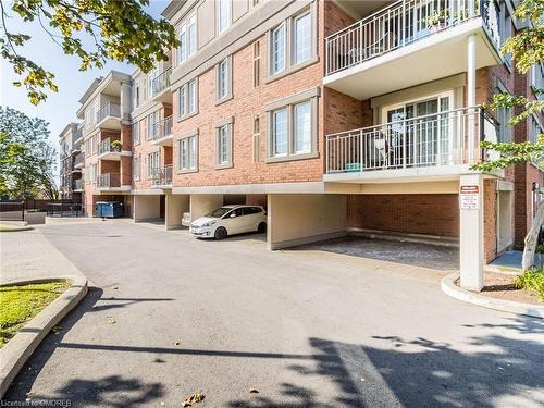 209-2301 Parkhaven Boulevard, Oakville, ON - Outdoor With Balcony With Facade