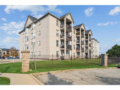 209-1411 Walker'S Line, Burlington, ON - Outdoor With Balcony With Facade