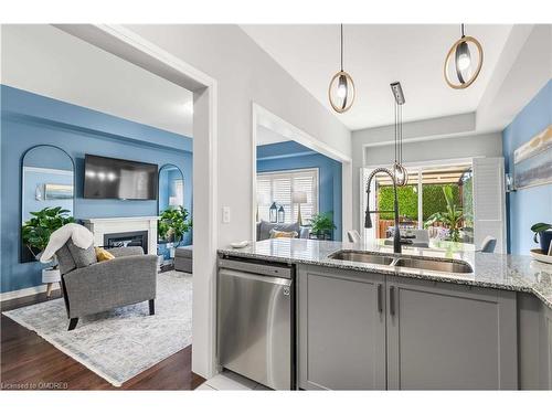 78 Leeson Street Street N, Grand Valley, ON - Indoor Photo Showing Kitchen With Fireplace With Double Sink